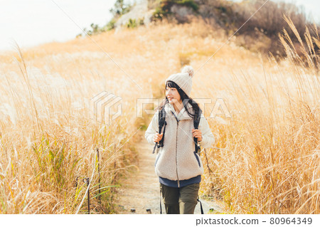 A woman trekking A woman trekking 80964349