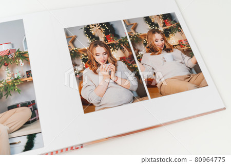 pages of photobook from photo shoot pregnancy on New Year's Day 80964775