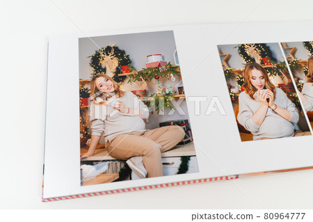 pages of photobook from photo shoot pregnancy on New Year's Day 80964777