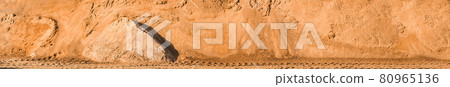 A large pile of sand in storage on industrial warehouse at a construction site 80965136