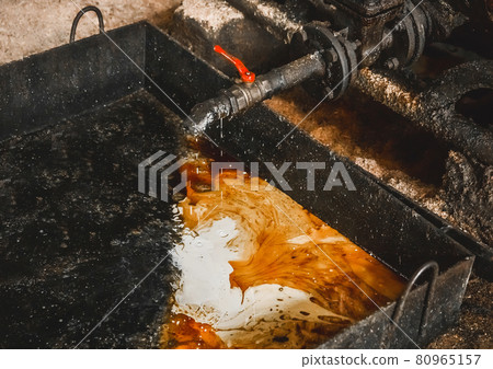 Drain oil-condensate mixture from an air compressor at an industrial plant 80965157