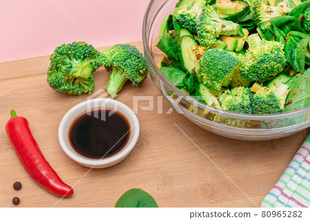 Fresh Green Salad of Avocado, Broccoli, Spinach and Cucumber Fresh Green Salad of Avocado, Broccoli, Spinach and Cucumber 80965282