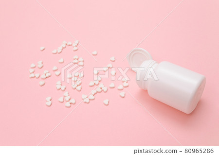 Pharmaceutical Industry and Medicinal Products - White Pills on Pink Table Pharmaceutical Industry and Medicinal Products - White Pills on Pink Table 80965286