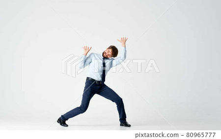 man in suit emotions office jump light background 80965777