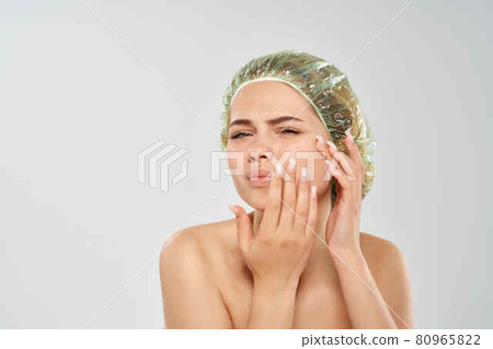 woman bare shoulder shower cap face skin care 80965822