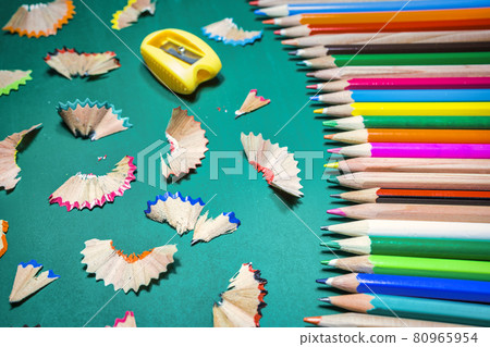 Colorful pencils over green chalkboard Colorful pencils over green chalkboard 80965954