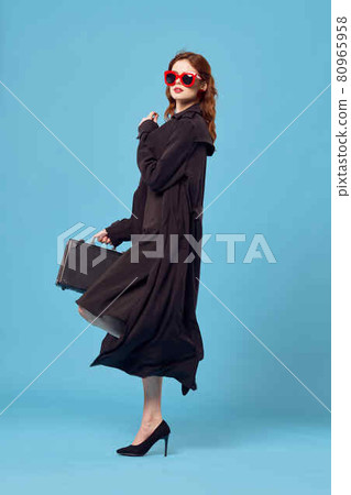 woman in black coat travel official vacation lifestyle 80965958