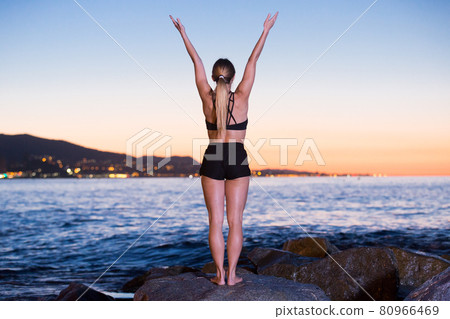 Adult woman is practicing stretching 80966469