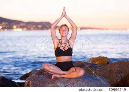 Female is meditating 80966549