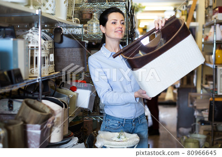 Glad woman choosing purpose basket Glad woman choosing purpose basket 80966645