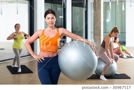 Woman with fitness ball 80967517