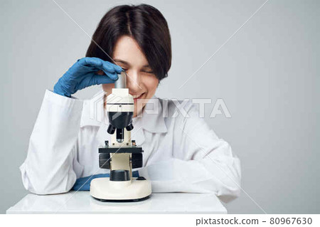 woman scientist laboratory science research microscope 80967630