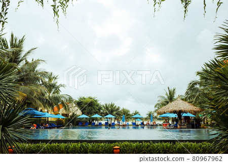 Overlooking the leisurely resort pool (Da Nang, Vietnam) Overlooking the leisurely resort pool (Da Nang, Vietnam) 80967962