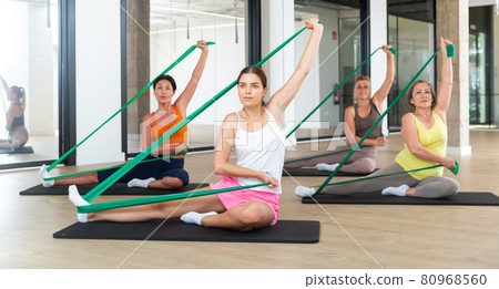 Women doing stretches with resistance bands Women doing stretches with resistance bands 80968560