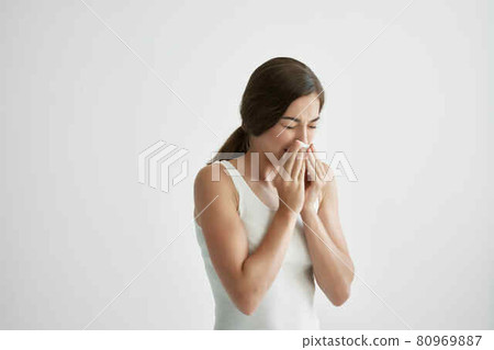 sick woman in white tank top handkerchief runny nose health problems cold flu sick woman in white tank top handkerchief runny nose health problems cold flu 80969887