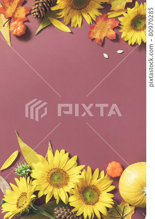 Autumn composition. Creative layout made of festive autumn decor of pumpkins, sunflowers and leaves on a brown background. Nature Trendy Decorative Design. Flat lay with copy space. Autumn composition. Creative layout made of festive autumn decor of pumpkins, sunflowers and leaves on a brown background. Nature Trendy Decorative Design. Flat lay with copy space. 80970285