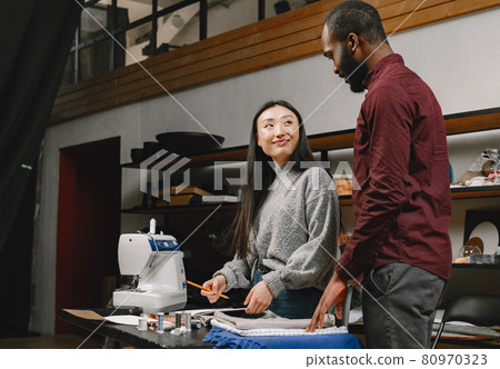 Diverse designers coworkers talking in the workshop 80970323