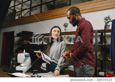 Diverse designers coworkers talking in the workshop 80970325