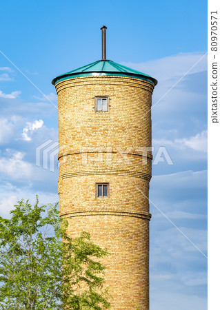 Water tower of artesian well. Outdoors, day light front view. Water tower of artesian well. Outdoors, day light front view. 80970571