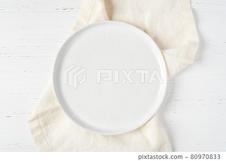 An empty plate on a white table. An empty plate on a white table. 80970833