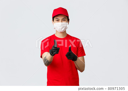 Happy delivery guy in medical mask and gloves, smiling with eyes as pointing camera, recommend carrier company service, provide fast and safe courier shipping, advertising and promoting Happy delivery guy in medical mask and gloves, smiling with eyes as pointing camera, recommend carrier company service, provide fast and safe courier shipping, advertising and promoting 80971305