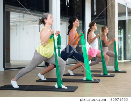 Women stretching with resistance bands Women stretching with resistance bands 80971463
