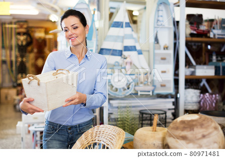Woman standing with wooden box Woman standing with wooden box 80971481