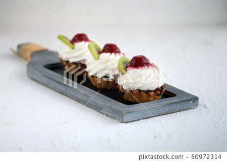 Sweet cup cake muffin with ice-cream, selective focus 80972314