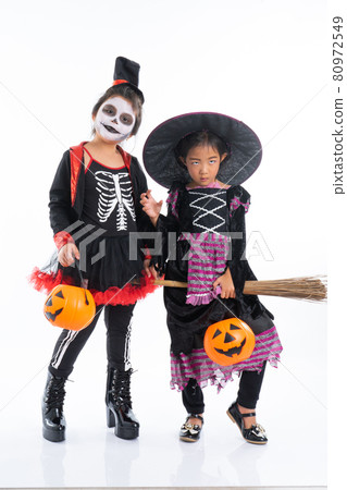 Portrait pair of little girls in Halloween and carnival costume isolated on white background Portrait pair of little girls in Halloween and carnival costume isolated on white background 80972549