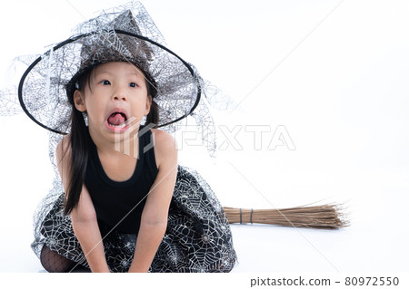 Portrait of little girl in Halloween and carnival costume ride the wooden broom isolated on white background Portrait of little girl in Halloween and carnival costume ride the wooden broom isolated on white background 80972550