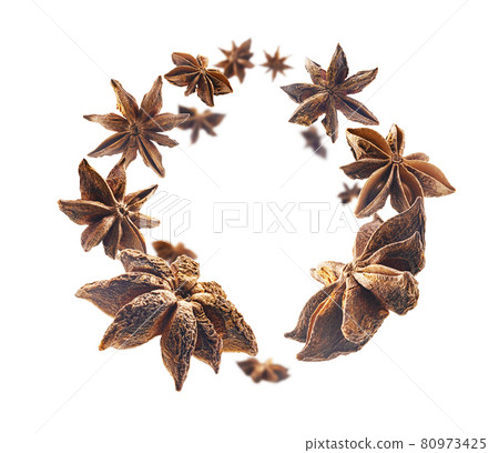 Anise stars levitate on a white background Anise stars levitate on a white background 80973425
