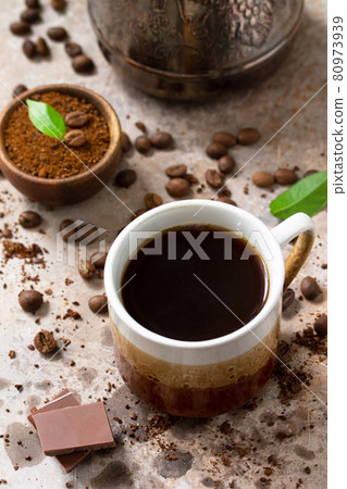 Background with Coffee cup and beans on concrete table. 80973939