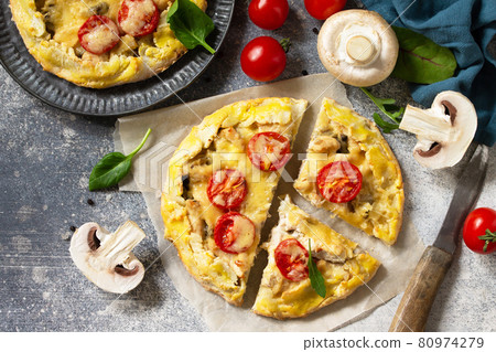 Homemade pastries with whole grain flour. Galette with chicken, cheese and mushrooms on a stone or slate countertop. Top view flat lay background. Homemade pastries with whole grain flour. Galette with chicken, cheese and mushrooms on a stone or slate countertop. Top view flat lay background. 80974279