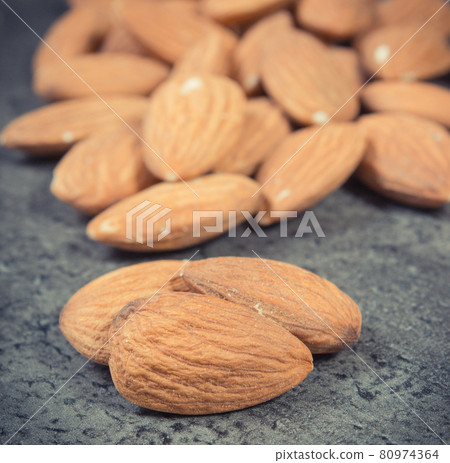 Fresh healthy almonds containing vitamins and minerals. Nutritious eating Fresh healthy almonds containing vitamins and minerals. Nutritious eating 80974364