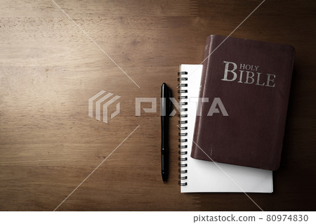 Holy bible with note book and pencil on wooden table for christian devotion and copy space Holy bible with note book and pencil on wooden table for christian devotion and copy space 80974830