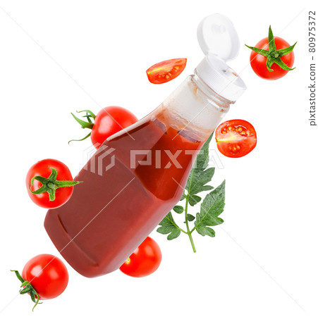 A bottle of ketchup and cherry tomatoes are flying on a white background, cut. Isolated A bottle of ketchup and cherry tomatoes are flying on a white background, cut. Isolated 80975372