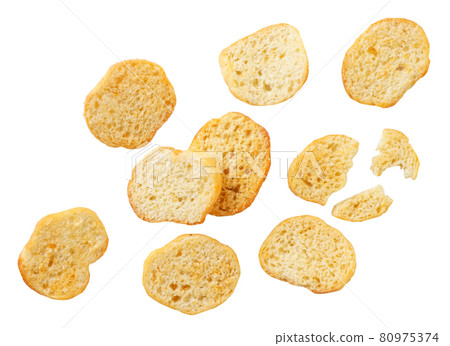 Croutons falling on a white background, levitating bread croutons. Isolated Croutons falling on a white background, levitating bread croutons. Isolated 80975374