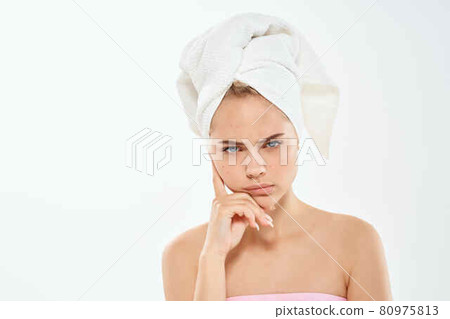 pretty woman with bare shoulders clear skin posing light background pretty woman with bare shoulders clear skin posing light background 80975813