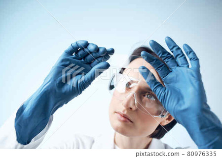 female laboratory assistant blue gloves research technology Science professional 80976335