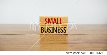 Small business symbol. Wooden blocks form the words 'small business' on beautiful wooden table, white background. Business, small business concept. Copy space. 80976690