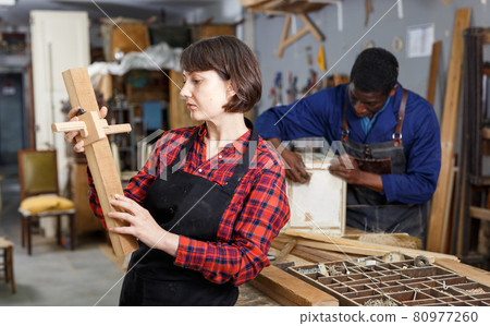 Female restorer working with furniture 80977260