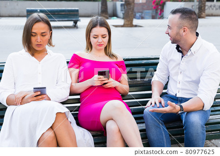 Girlfriends are rejecting stranger man who wants acquintance with them Girlfriends are rejecting stranger man who wants acquintance with them 80977625