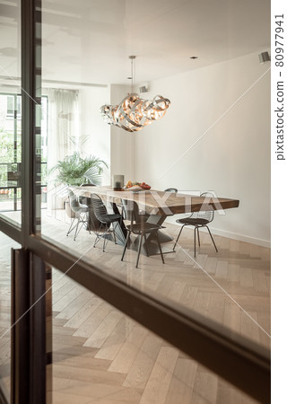Bright dining room with decorative table and chairs Bright dining room with decorative table and chairs 80977941