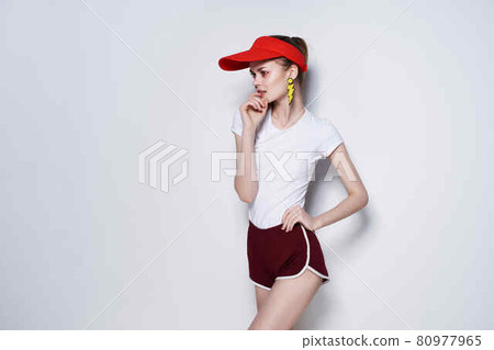 cheerful girl in red cap mesh decoration posing summer fashion 80977965