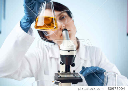 women scientists chemical solutions microscope research experiment 80978004