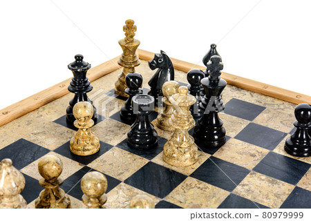 stone chess pieces on beige and black coral marble chessboard 80979999