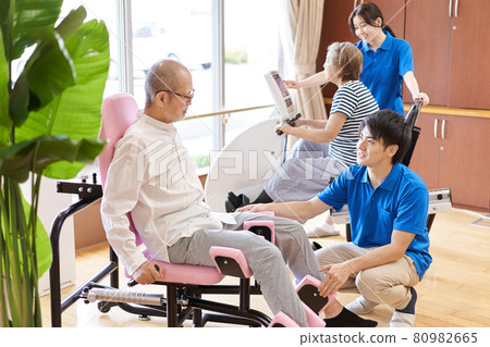 Elderly people exercising in the fitness corner of a long-term care facility Elderly people exercising in the fitness corner of a long-term care facility 80982665