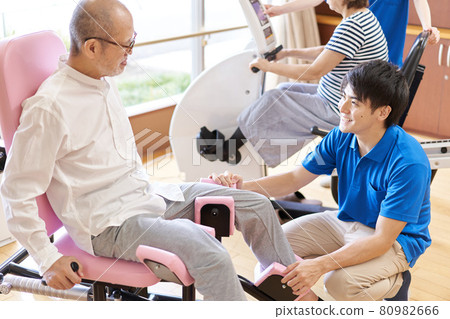 Elderly people exercising in the fitness corner of a long-term care facility Elderly people exercising in the fitness corner of a long-term care facility 80982666