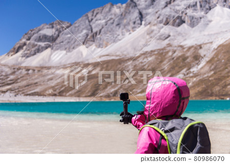 Hand traveler woman holding action camera at mountain,Navigation for travel Hand traveler woman holding action camera at mountain,Navigation for travel 80986070