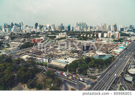 Panoramic view of cityscape and construction site in metropolis Panoramic view of cityscape and construction site in metropolis 80986801